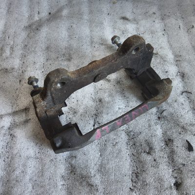 Jarzmo zacisku hamulca lewy przód Fiat Linea